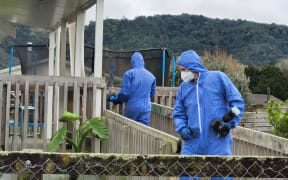 Police can be seen executing a search warrant at a Taraire Street property in Kaikohe following the death of Linda Woods on 1 June.