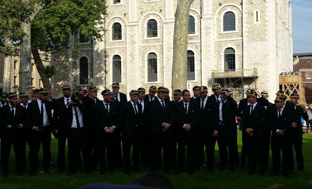 The All Blacks in their commemorative caps.