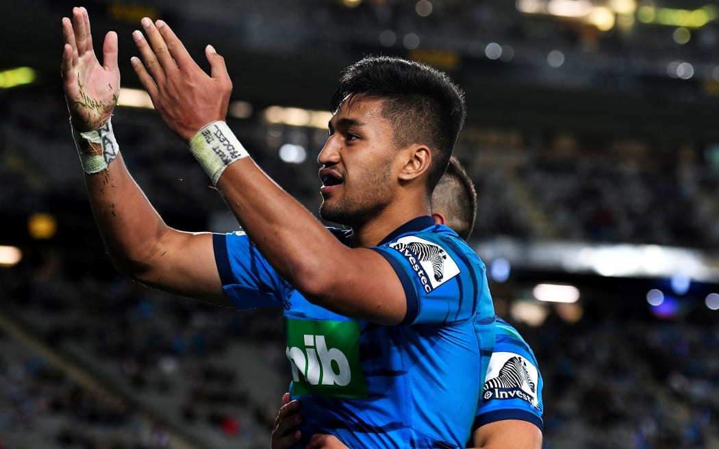 Rieko Ioane celebrates yet another try for the Blues.