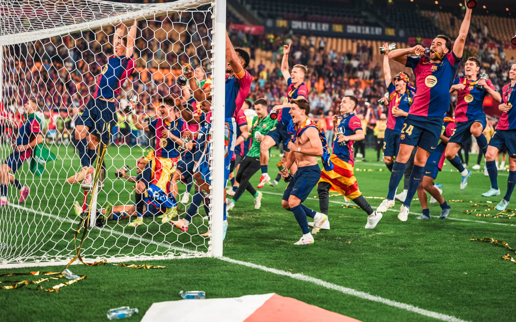 Barcelona players celebrate their win after the Spanish Cup, Copa del Rey, final against Real Madrid on 26 April 2025 in Seville.