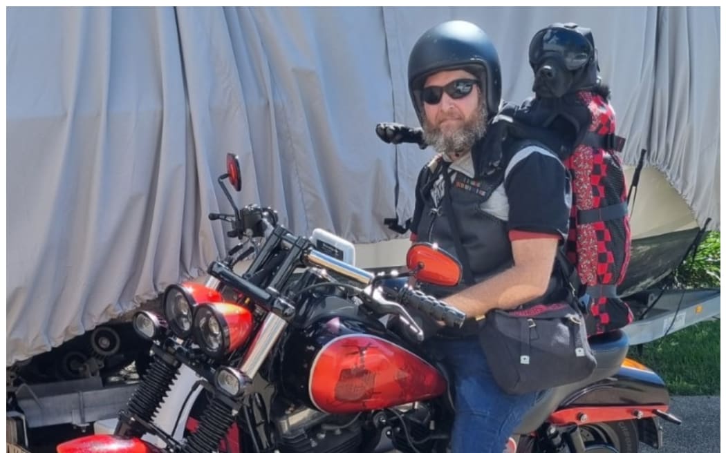 Stevin Creegan gets on his Harley Davison with his best mate Loki.