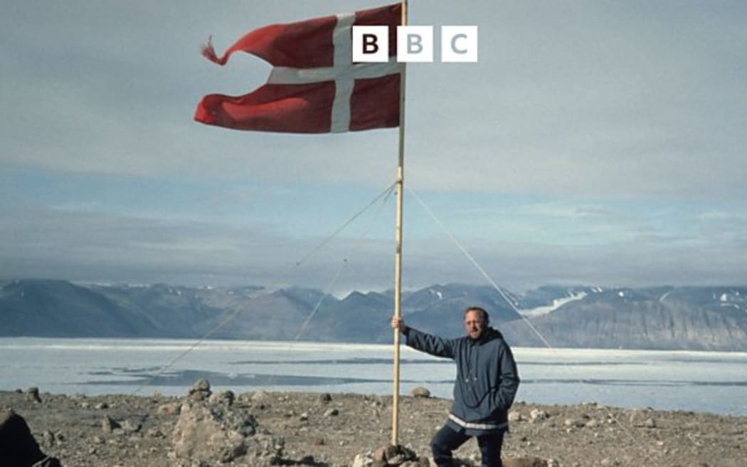 Tom Hoyem with a Danish flag on Hans Island