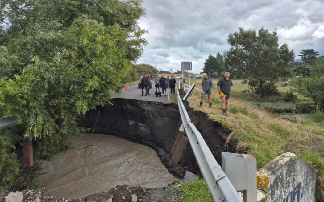 A large hole has opened up at the Lake Ferry Road bridge cutting off communities in South Wairarapa.