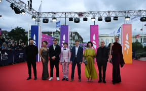 (From L) US actor Clayton Royal Johnson, US producer Christa Boarini, US director Todd Wiseman Jr., US actors Kue Miller Lawrence, Hudson Meek, US actress Christina Brucato, US actor Michael Sean Tighe and US model singer and photograph Eugenie Bondurant pose as they present the competing film "The School Duel" for the 50th edition of the Deauville American film festival, in Deauville, northern France, on September 9, 2024.