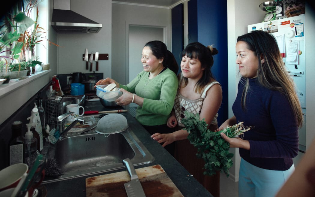 (L-R) Hương, Ly, and Hà prepare lunch