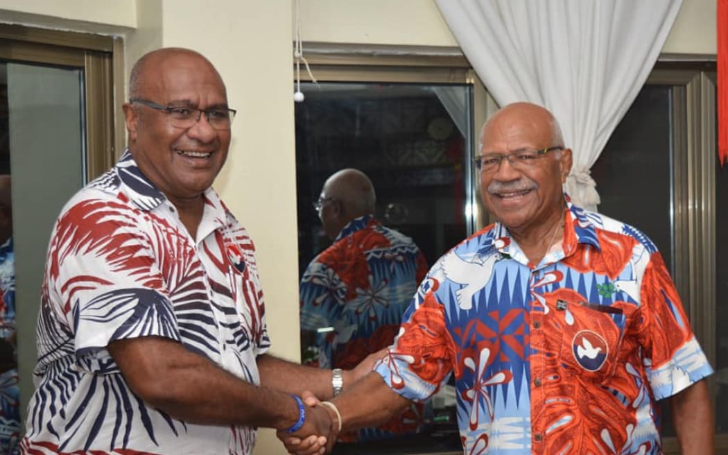 Manoa Kamikamica, left, and Sitiveni Rabuka.