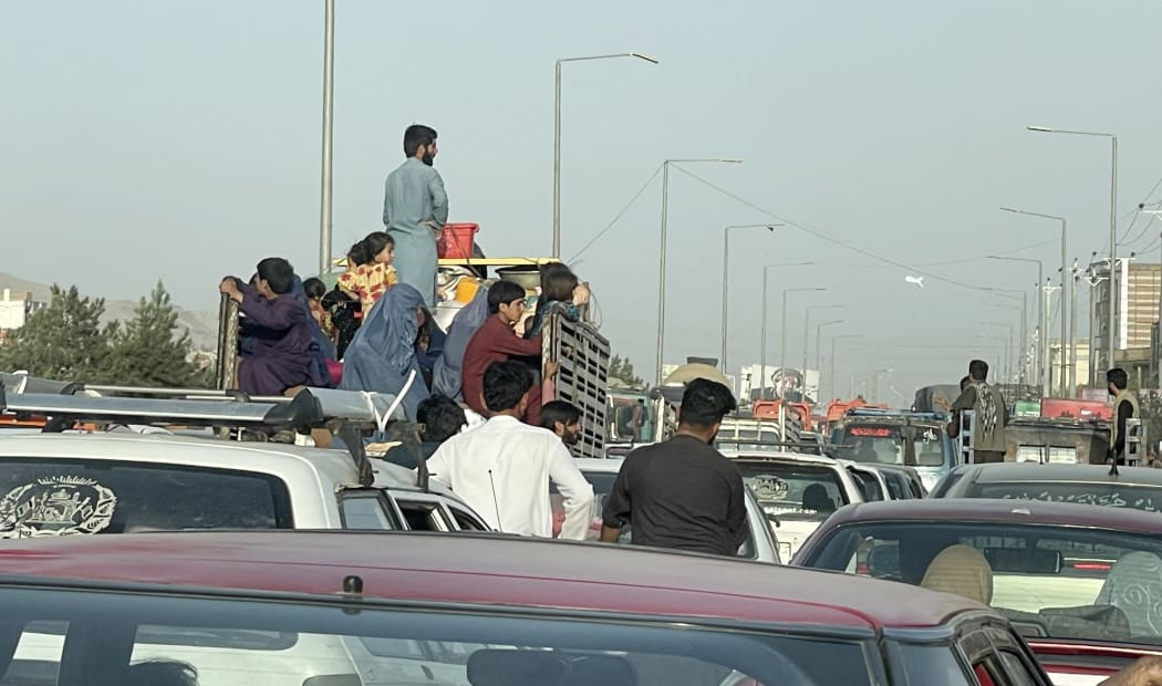 An Afghan family flee Kabul city, Afghanistan, on August 15, 2021.