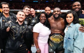 Aljamain Sterling celebrates with friends and family follwoing his win at UFC 288.