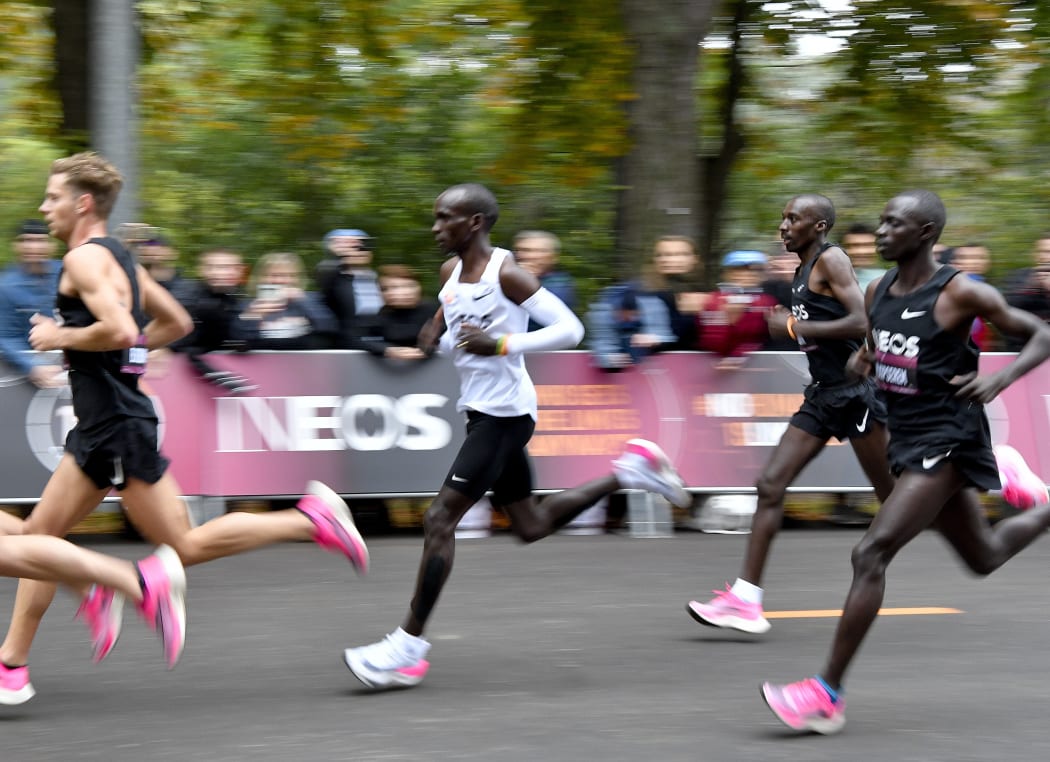 Kenya's Eliud Kipchoge (white jersey) runs during his attempt to bust the mythical two-hour barrier for the marathon on October 12 2019 in Vienna.