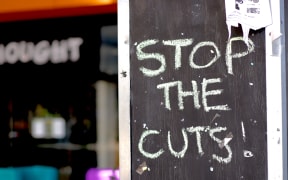 A sign protesting against Massey University's proposal to slash courses and jobs.
