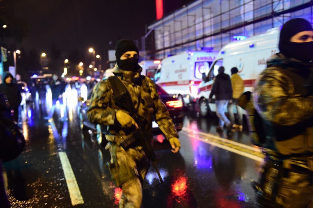 Turkish special force police officers and ambulances are seen at the site of an armed attack January 1, 2017 in Istanbul.