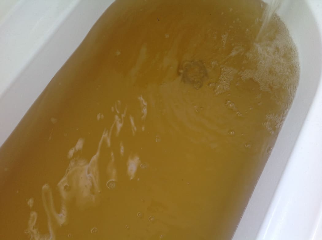 Discolored water fills a bath tub in Foxton Beach.