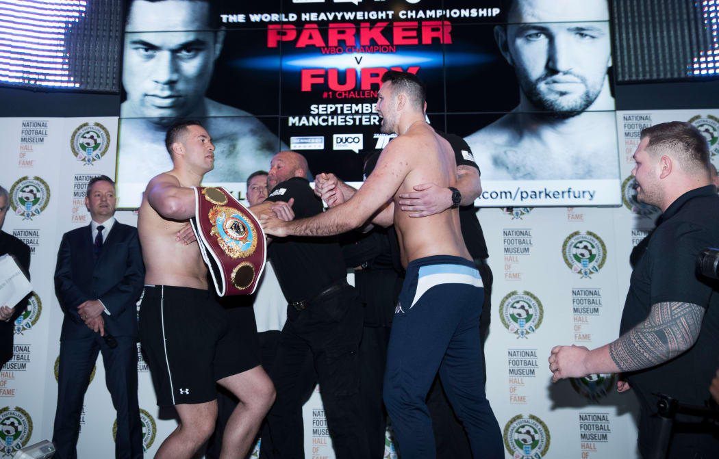 Boxers Joseph Parker and Hughie Fury scuffle during their pre-bout weigh-in