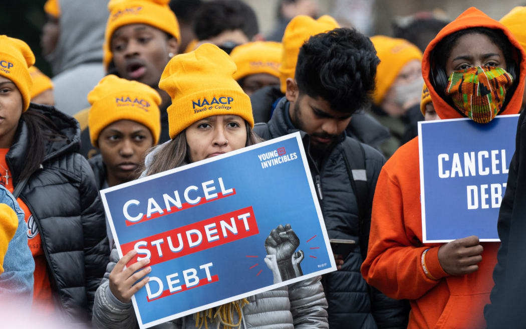 Activists and students protest in front of the Supreme Court during a rally for student debt cancellation in Washington, DC, on 28 February, 2023.