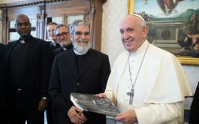 Brother Guy and the Late Pope Francis smile.