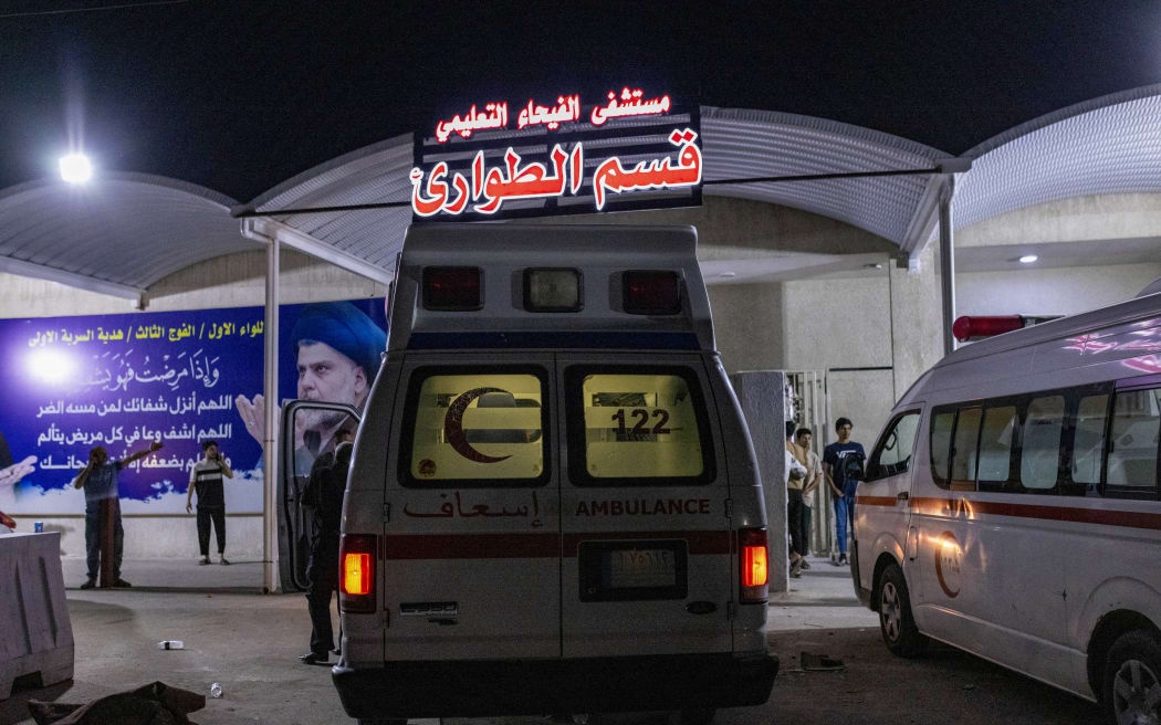Ambulances are pictured outside the emergency ward at a hospital in the southern city of Basra on April 2, 2024. At least six students were killed and 14 injured on April 2 when a truck ploughed into them on their way out of school in Iraq's southern province of Basra, authorities said. (Photo by Hussein FALEH / AFP)