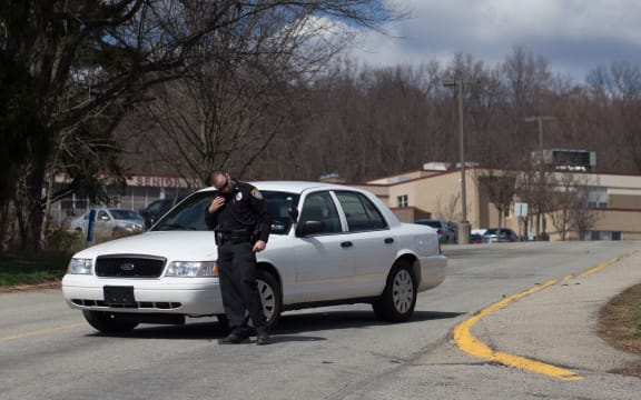 A police officer outside Franklin Regional Senior High School.