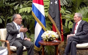 Papua New Guinea Prime Minister Peter O'Neill (left) talks with President of Cuba Raul Castro in Havana.