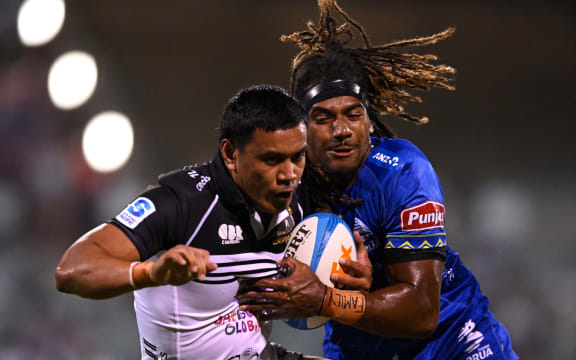 Len Ikitau of the Brumbies is tackled by Selestino Ravutaumada of the Drua during the Super Rugby Pacific Round 5 match between the Brumbies and the Fijian Drua at GIO Stadium in Canberra, Friday, March 14, 2025. (AAP Image/Lukas Coch / Photosport) NO ARCHIVING, EDITORIAL USE ONLY