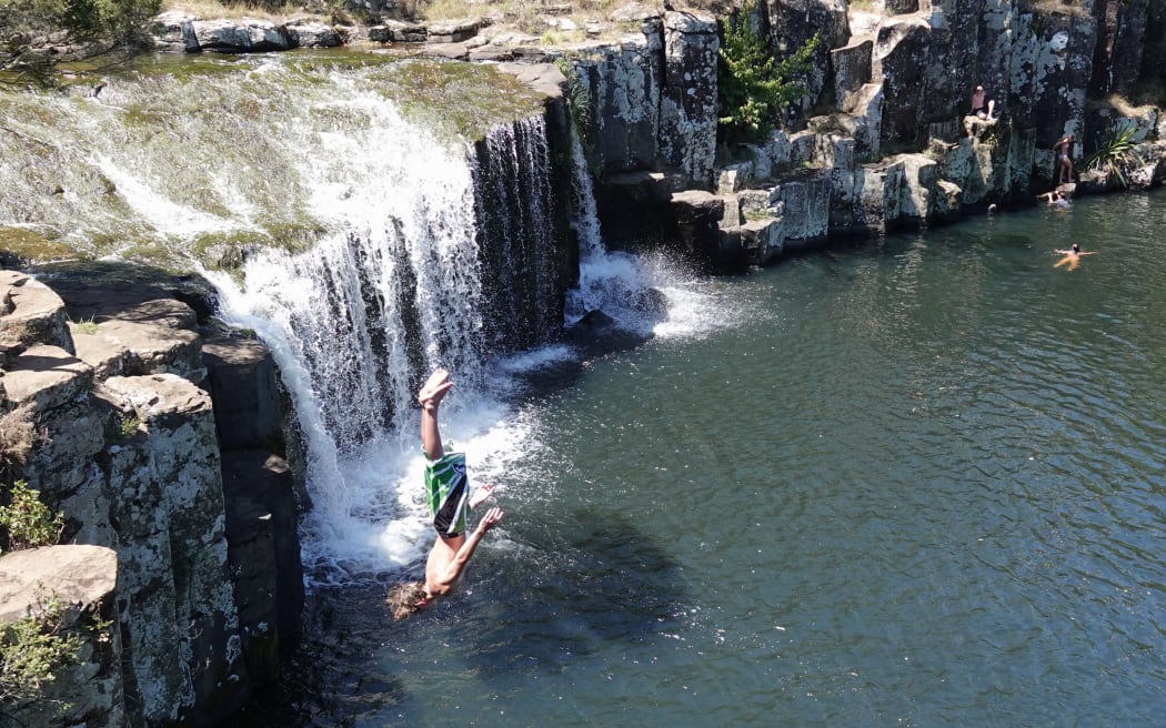 Tommy Lodge backflips from the top of the falls at Charlie’s Rock, on Kerikeri’s Waipapa River.