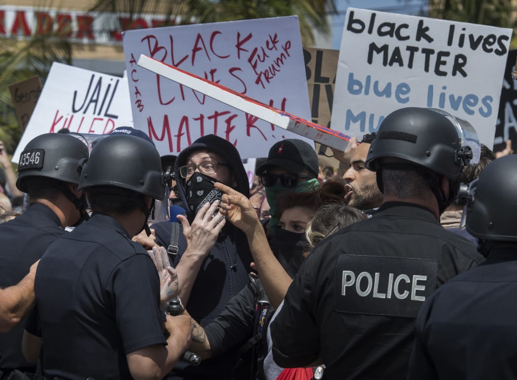 Demonstrators confront police in Los Angeles, California.
