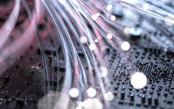 Fibre optics carrying data at speed to a computer (Photo by Andrew Brookes / Connect Images / Connect Images via AFP)