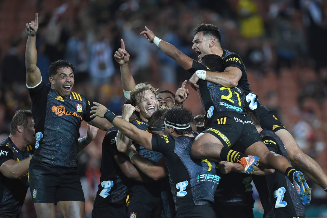 Damian McKenzie celebrates with the team