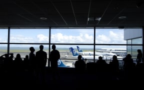 Passengers wait for their flights at Auckland Airport.