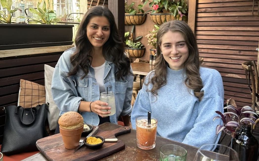 Sophia Malthus (right) with her friend and caregiver Indy.