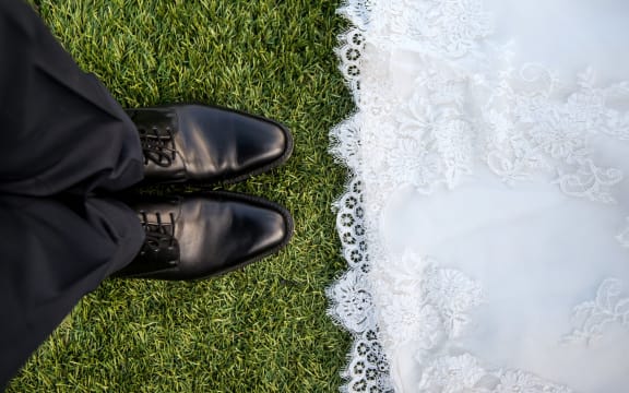 wedding mens shoes and edge of gown