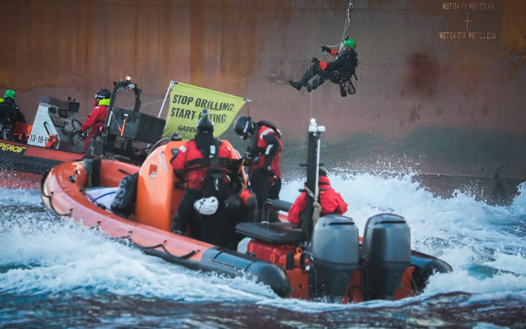 Greenpeace activists during a protest at a Shell platform, on the way to the North Sea, to expand an existing oil and gas field, off the coast of France on 6 February 2023.