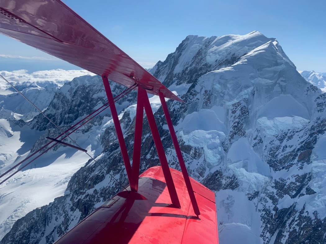 Aviation Adventures owner Chris Rudge flew a Grumman Ag-Cat aircraft over Aoraki/Mount Cook to mark a century since the maiden voyage.