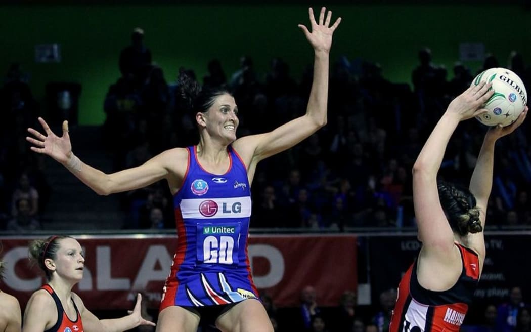 Anna Harrison gets high to pressure the shot from Ellen Halpenny of the Tactix. ANZ Netball Championship, Northern Mystics vs Canterbury Tactix, Trusts Stadium, Auckland, New Zealand. Sunday 27th May 2012. Photo: Anthony Au-Yeung / photosport.co.nz