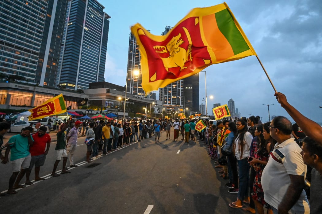 Anti-government demonstrators take part in a protest near the President's office in Colombo on 10 May 2022.