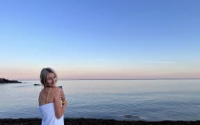 Samantha Mythen poses by the sea in Cornwall, England