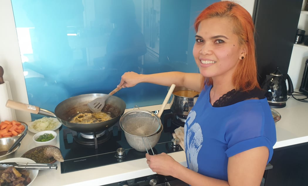 Een Olsen preparing peanut crackers