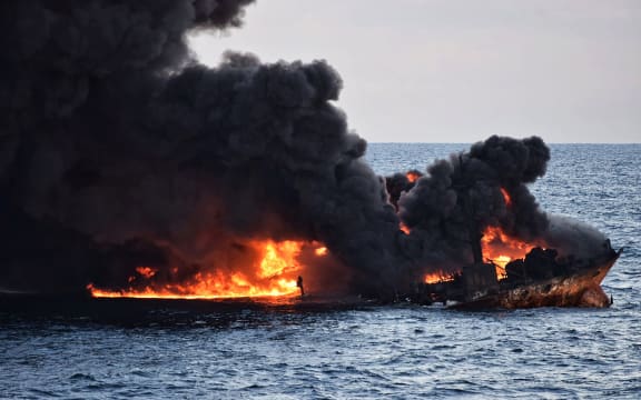 This handout file picture from the Transport Ministry of China taken and released on January 14, 2018 shows smoke and flames coming from the burning oil tanker "Sanchi" at sea off the coast of eastern China.