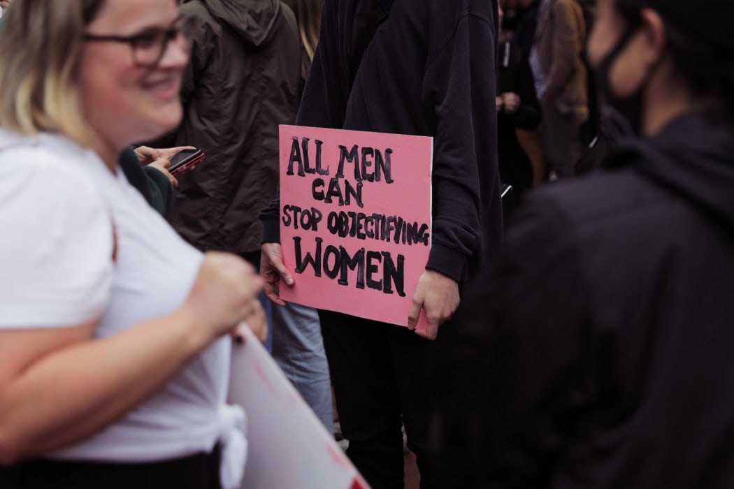 People gathered on Courtenay Place in Wellington to rally against sexual violence.
