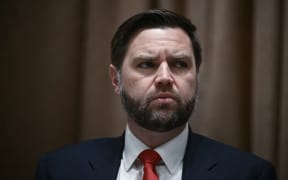 US Vice President JD Vance listens before a luncheon with Italian Prime Minister Giorgia Meloni in the Cabinet Room of the White House, in Washington, DC, on April 17, 2025. Italy's Prime Minister Giorgia Meloni meets with Donald Trump Thursday in Washington, hoping a personal charm offensive can help convince the US president to cut a more favourable deal on EU tariffs. (Photo by Brendan SMIALOWSKI / AFP)