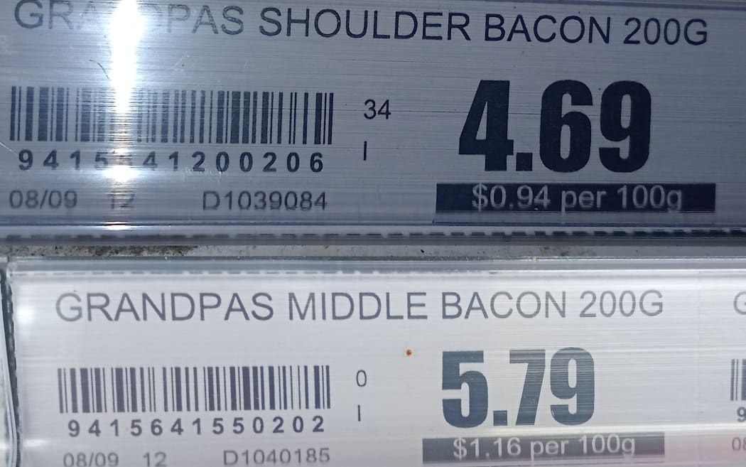 Two supermarket price tags that don't quite add up.