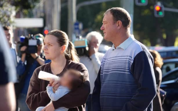 Jana Armstrong’s sister Faith Isaacs outside court with her sister’s child, with her father and with friends.