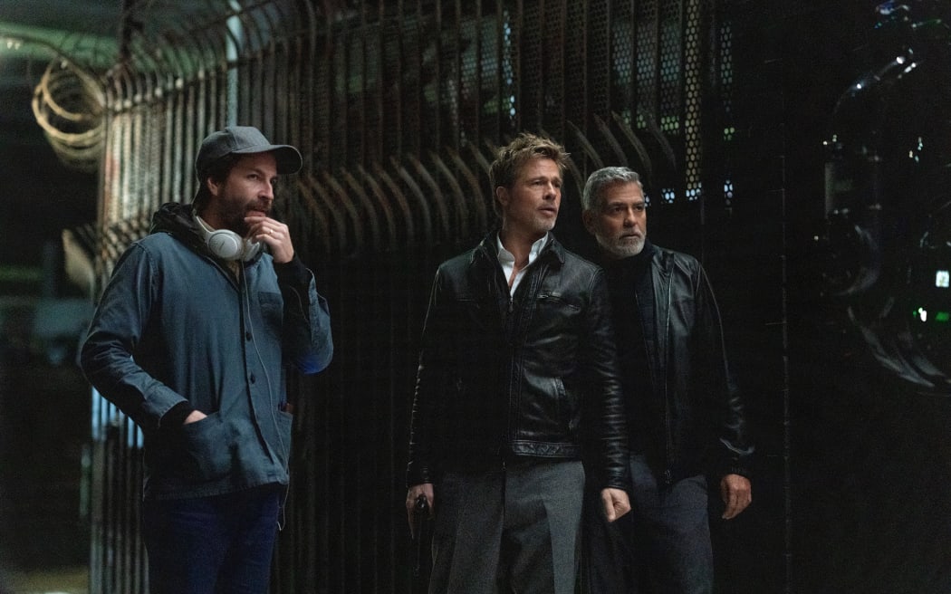 Filmmaker Jon Watts with Brad Pitt and George Clooney in 'Wolfs'.