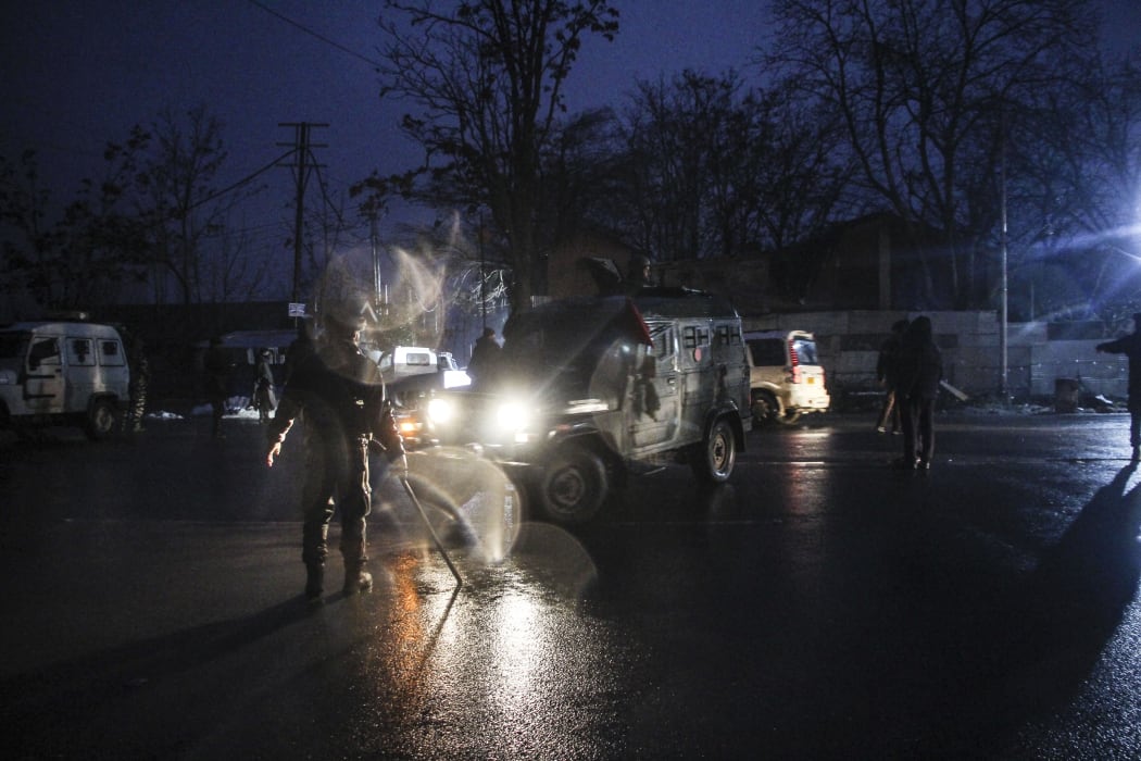 KASHMIR, INDIA - FEBRUARY 14 : Indian army soldiers keep vigil near the scene of attack in Lethpora area on the outskirts of Srinagar, Kashmir, India on February 14, 2019. At least 40 Indian paramilitary soldiers were killed by a massive car bomb blast