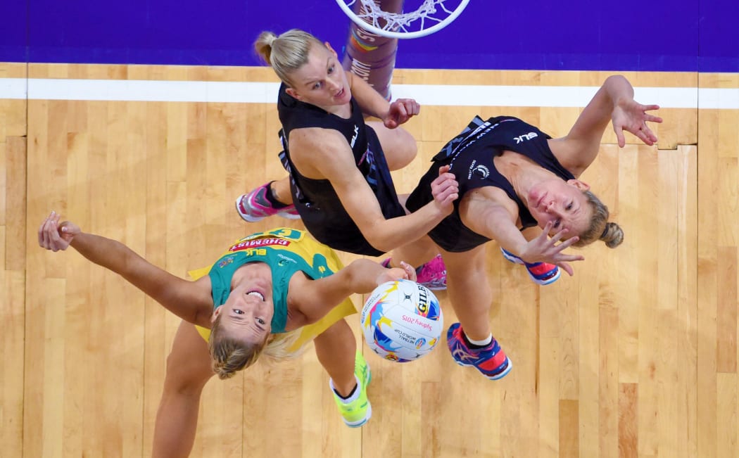 Silver Ferns defenders Casey Grant (left) and Casey Kopua battle it out with Australia shooter Caitlin Bassett.