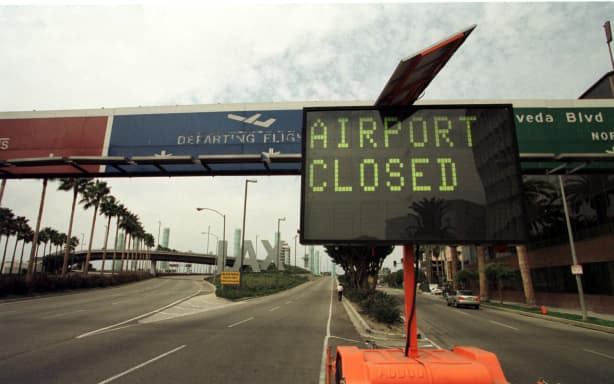A board at the Los Angeles Airport announces the closing of the airport following an alleged coordinated terrorist attack to the World Trade Center twin towers in New York and the Pentagon in Washington DC 11 September, 2001. Some of the hijacked planes used for the attacks were heading to Los Angeles. AFP PHOTO  Gerard Buckhart (Photo by GERARD BURKHART / AFP)