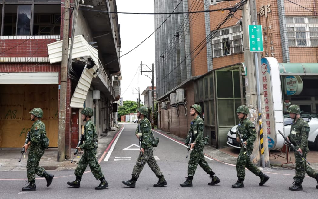 Soldiers march along a street during the Han Kuang military exercise in Taoyuan, Taiwan, on July 26, 2023.