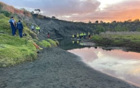 A sand dune collapsed on a man when he was digging a hole in it at Muriwai.