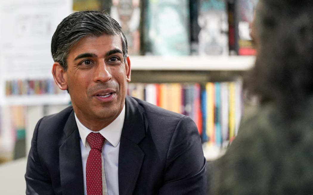 Britain's Prime Minister Rishi Sunak speaks with students' parents during a visit at the Haughton Academy in Darlington, north east England, on January 29, 2024 to outline plans for the banning of single use vapes. The UK will introduce legislation to ban disposable e-cigarettes in order to tackle a rise in youth vaping, announced Britain's Prime Minister Rishi Sunak on January 29, 2024 during a visit to a school in Darlington. Health experts welcomed the proposal, with Chief Medical Officer Chris Whitty saying the legislation would have "a major public health impact across many future generations". (Photo by Ian Forsyth / POOL / AFP)