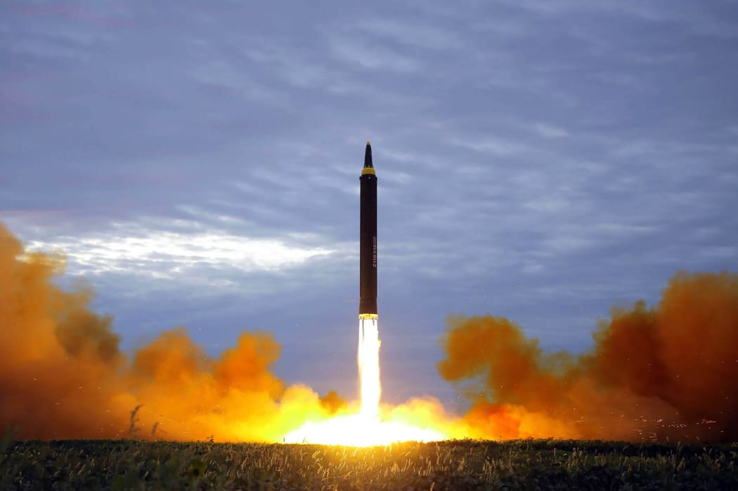 This picture from KCNA - taken on 29 August and released on 30 August - shows North Korea's Hwasong-12 lifting off from an undisclosed location near Pyongyang.