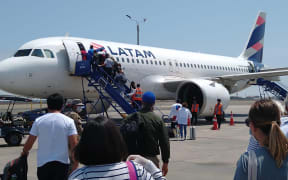 New Zealanders boarding a flight back home after being stranded in Peru due to Covid-19.
